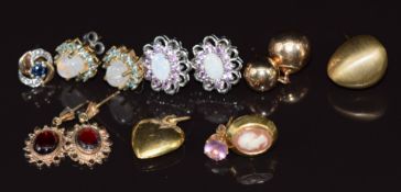 Three pairs of 9ct gold earrings set with opals and topaz, garnet, labradorite and topaz, a 9k