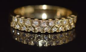 An 18ct gold ring set with two rows of diamonds, 4g, size N
