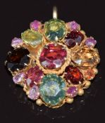 A silver gilt pendant set with rubies, tourmaline, citrine, garnet, etc