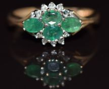 A 9ct gold ring set with four oval emeralds and diamonds, 3.2g, size J
