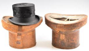 Two vintage top hats, in leather cases, one tapering example by Hanbidge, Sheffield 19 x 15cm, the