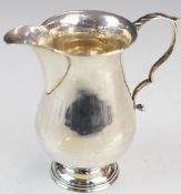 George VI hallmarked silver jug of baluster form, Birmingham 1939, maker William Hutton & Sons