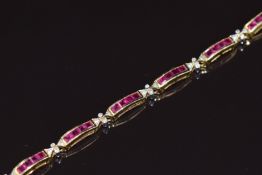 An 18k gold bracelet set with calibre cut rubies and diamonds, 13.2g 18.5cm