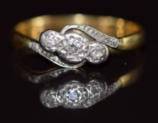 An 18ct gold ring set with three diamonds in a platinum setting, 2.8g, size P