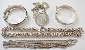 Hallmarked silver bangles, silver chains, guard chain, mounted 1885 silver dollar, 241g
