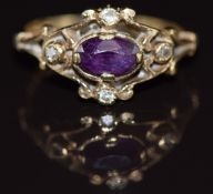 A 9ct gold ring set with an oval cut amethyst and diamonds, 2g, size I