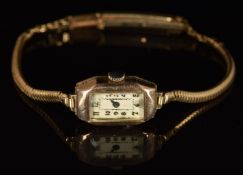 Unnamed 9ct gold ladies wristwatch with blued hands, gold Arabic numerals, silver dial and