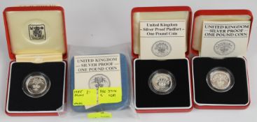 Four Royal Mint silver proof £1 coins comprising three piedforts for 1984 Scotland, 1985 Wales and