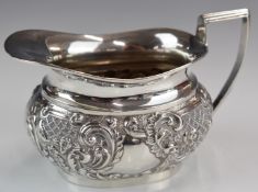 Edward VII hallmarked silver milk jug with embossed decoration, Birmingham 1901, maker William