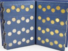 A collection of post 1946 UK sixpences contained in a Sandhills Coin Library album