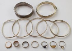 Seven silver bangles, five silver rings and two 9ct gold and silver rings