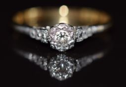 An 18ct gold ring set with a diamond in a platinum setting, 2.2g, size R