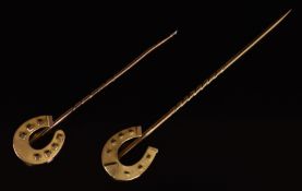 Two 9ct gold stick pins in the form of horseshoes, Birmingham 1894 and 1896, 2g