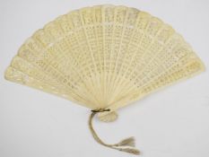 19thC carved bone fan, the guard sticks 22.5cm