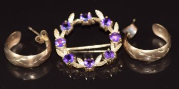 A 9ct gold brooch set with amethysts and a pair of 9ct gold earrings, 5.7g