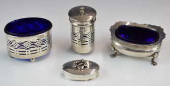 Two hallmarked silver open salts with blue glass liners, hallmarked silver pepper to match the
