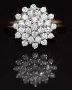 A 9ct gold ring set with diamonds in a cluster, 3.5g, size N