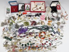 A collection of costume jewellery including diamanté, silver suite of jewellery set with amber,