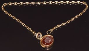 A c1900 9ct gold fob chain made up of mariners links, with swivel fob set with a bloodstone intaglio