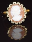 A 9ct gold ring set with a cameo depicting a young woman, 2.1g, size O