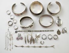 A collection of silver jewellery including buckle bangle (Birmingham 1884), two further bangles,