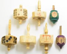 Seven 19thC carved bone and treen teetotums, probably Napoleonic prisoner of war, tallest 6cm