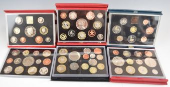 A collection of eighteen Royal Mint proof year presentation packs comprising 1983-1991, 1993,
