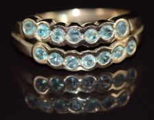 A 9ct gold ring set with two rows of topaz, 3.1g, size N