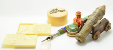 A 19thC Chinese carved soapstone cannon, length 12cm, Victorian glass dip pen with ornate nib,