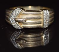 A 9ct gold buckle ring set with diamonds, 4.5g, size R