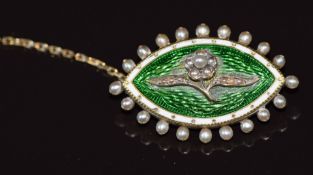 Victorian yellow metal mourning brooch with a seed pearl flower mounted on green and white guilloché