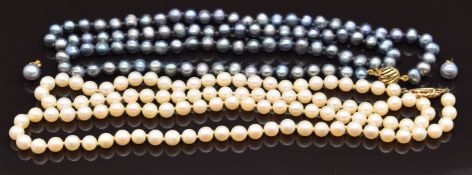 Two single strands of cultured pearls with 9ct gold clasps and a pair of 18ct gold earrings set with