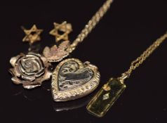 A 9ct gold pendant in the form of a rose, a 9ct gold pendant set with a diamond, two 9ct gold