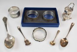 Four hallmarked silver napkin rings, including a modern feature hallmarked pair in gift box,