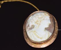 A c1900 9ct rose gold brooch set with a cameo depicting a young woman