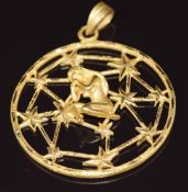 An 18ct gold bespoke pendant in the form of a network of stars with figure of a woman to the centre,