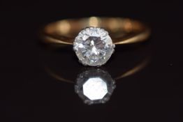 An 18ct gold ring set with a round brilliant cut diamond of approximately 0.96ct, 2.6g, size L