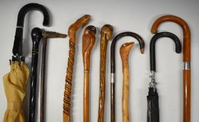 Walking sticks and umbrellas to include Briggs hallmarked silver mounted cane, double umbrella etc