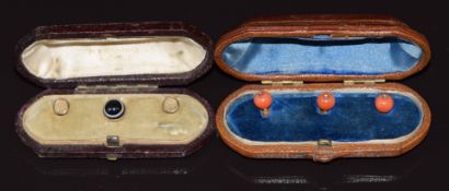 A set of three 9ct gold studs set with coral and a rose cut diamonds, in fitted box, and three 9ct