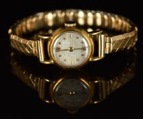 Unnamed 18ct gold ladies wristwatch with gold hands and hour markers, silver dial and mechanical