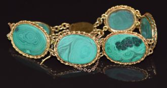 An 18ct gold bracelet set with malachite plaques, 27.5g  21cm