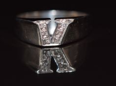 An 18ct white gold ring set with diamonds in a V shape, 3.2g, size O