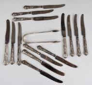 Fourteen hallmarked silver handled knives and a pair of Georgian fiddle pattern hallmarked silver
