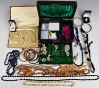 A collection of costume jewellery including paste brooches, diamanté necklace, coral earrings,