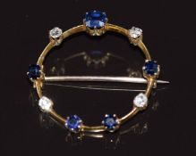 A c1915 9ct gold brooch set with sapphires and old cut diamonds, 2.7g 2.6cm