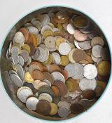 A vintage tin containing overseas coinage collection 19thC onwards, includes tokens and small silver