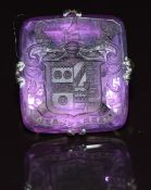 A 9ct white gold ring set with a carved amethyst intaglio, 7.8g, size N