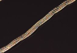 A 9ct gold tricolour twisted necklace with a textured surface, 19.4g