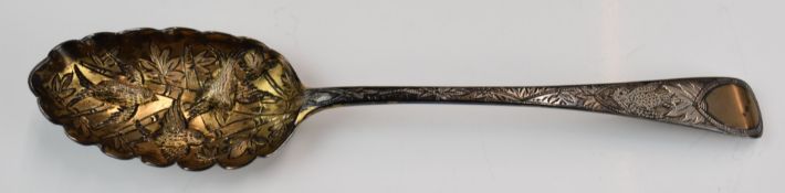 William IV hallmarked silver gilt berry spoon with Aesthetic style decoration of birds to the bowl