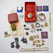 A collection of jewellery including Victorian locket, 9ct gold brooch, coins, silver medals, two